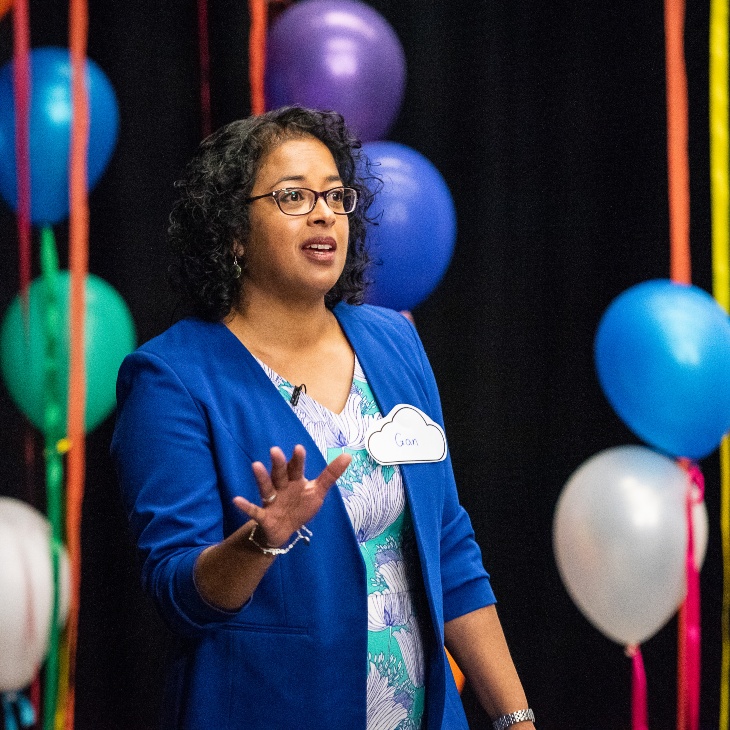 A woman speaks at an event