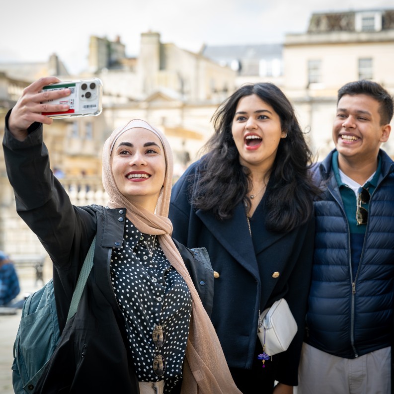 International students in Bath taking a selfie